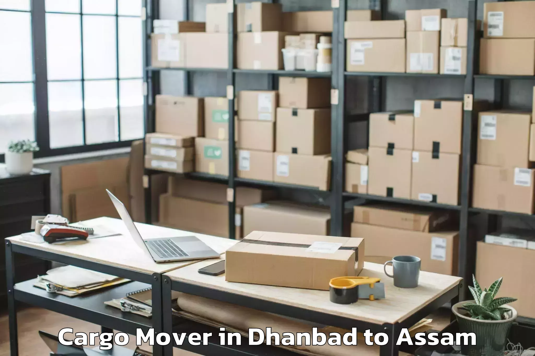 Leading Dhanbad to Paneri Kamrup Cargo Mover Provider